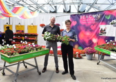 Ruud Brinkkemper and Lisa Lacy with PanAmerican Seed presenting their new Impatiens Downy Mildew resistant series Beacon. In the photo, they are comparing it with Super Elfin XP. Its plant structure, flowering time, flower size and crop culture is similar to Super Elfin, however Beacon impatiens exhibit high resistance to the currently known and widely prevalent populations of Plasmopara obducensm which cause impatients downy mildew.”